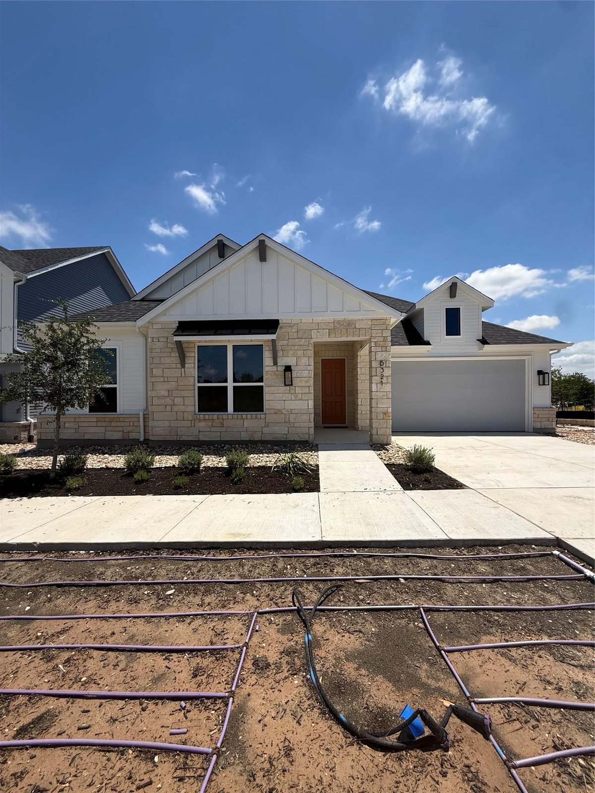 View 6321 McMurtry ST in Goodnight Ranch 6321 McMurtry ST - front exterior - Luxury home in Goodnight Ranch, Austin, TX