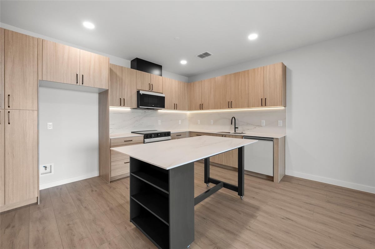 Kitchen at 634 Central Pkwy Unit #1211 - 3 bed 3 bath home