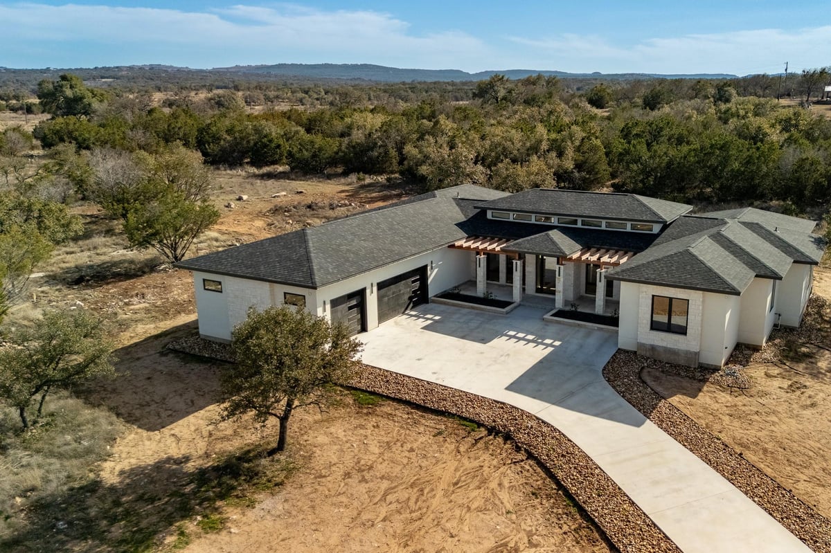 View 6425 Ranch Road 962 W 6425 Ranch Road 962 W - front exterior - Luxury home in Round Mountain, TX