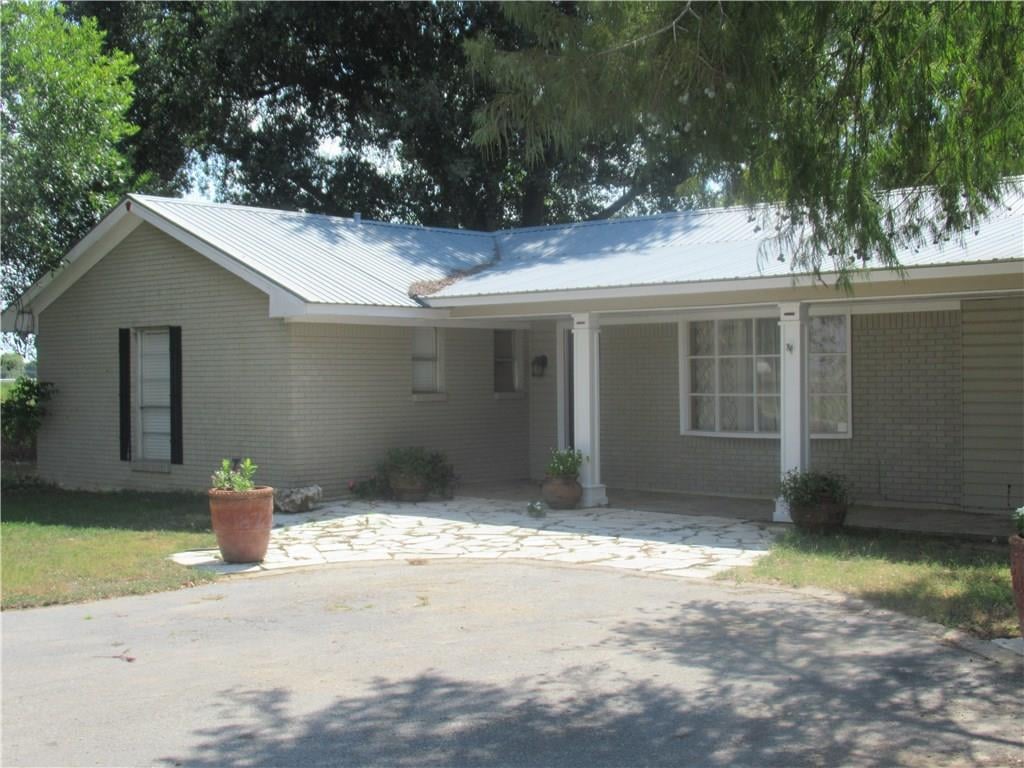 View 649 Faulkner RD 649 Faulkner RD - front exterior - Luxury home in Smithville, TX