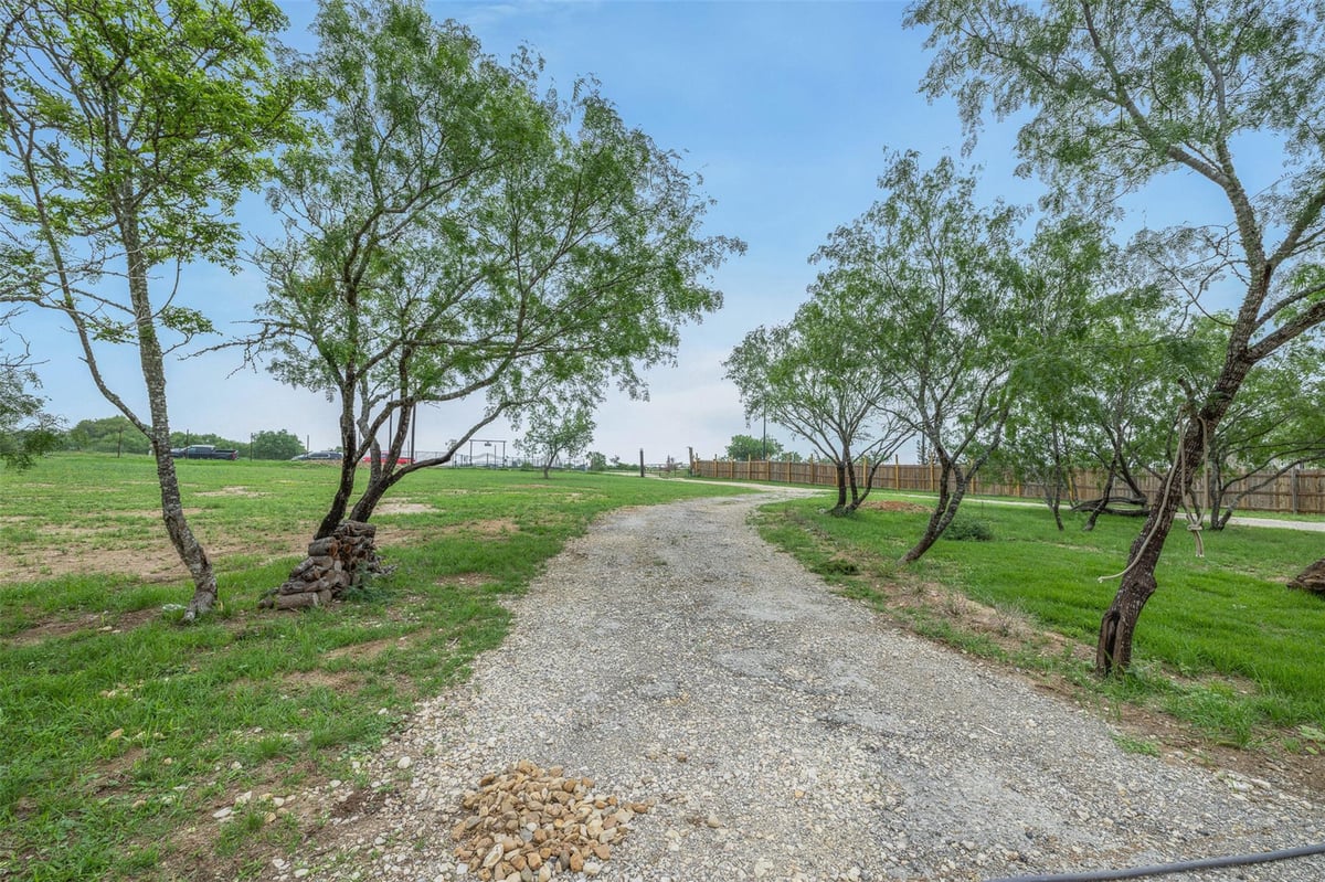 View 6497 Taylorsville Rd in VILLAGE RANCHETTES 6497 Taylorsville Rd - front exterior - Luxury home in VILLAGE RANCHETTES, Dale, TX