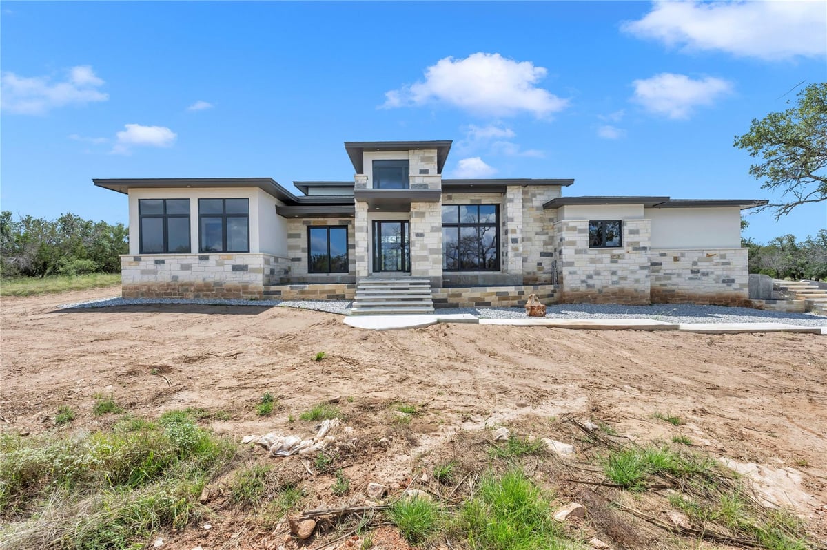 View 6507 Ranch Rd 962 W in Estates at Round Mountain 6507 Ranch Rd 962 W - front exterior - Luxury home in Estates at Round Mountain, Round Mountain, TX