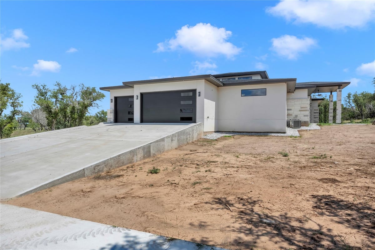 Primary bedroom at 6507 Ranch Rd 962 W - 4 bed 4 bath home