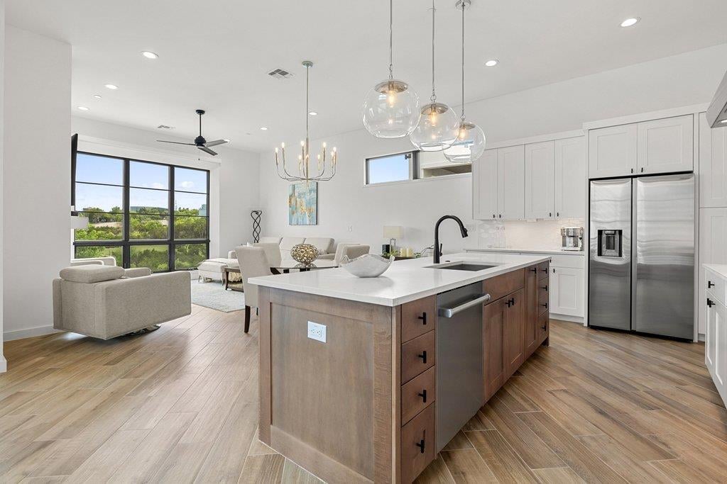 View 6603 Liliana LN Unit #5 in The Addie 6603 Liliana LN Unit #5 - living area with open living and dining area - Luxury home in The Addie, Austin, TX