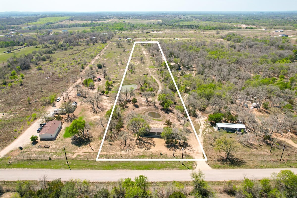 View 6739 Taylorsville Rd in Village Ranchettes Ph 1 6739 Taylorsville Rd - front exterior - Luxury home in Village Ranchettes Ph 1, Dale, TX
