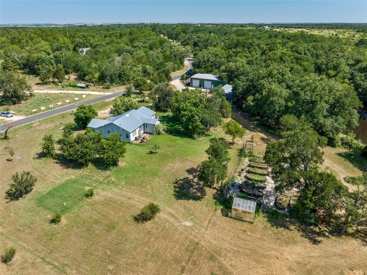 View 681 County Road 474 in MILLER 681 County Road 474 - front exterior - Luxury home in MILLER, Elgin, TX