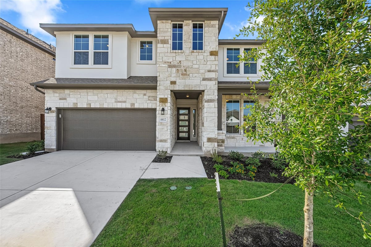 View 6812 Rounded Pebble Ln in Turners Xing North Ph 2 6812 Rounded Pebble Ln - front exterior - Luxury home in Turners Xing North Ph 2, Buda, TX