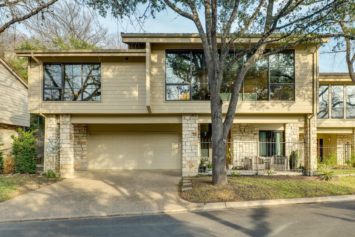 View 6820 N Cypress Pt Unit #33 in Woodslopes Lost Creek Condos 6820 N Cypress Pt Unit #33 - front exterior - Luxury home in Woodslopes Lost Creek Condos, Austin, TX