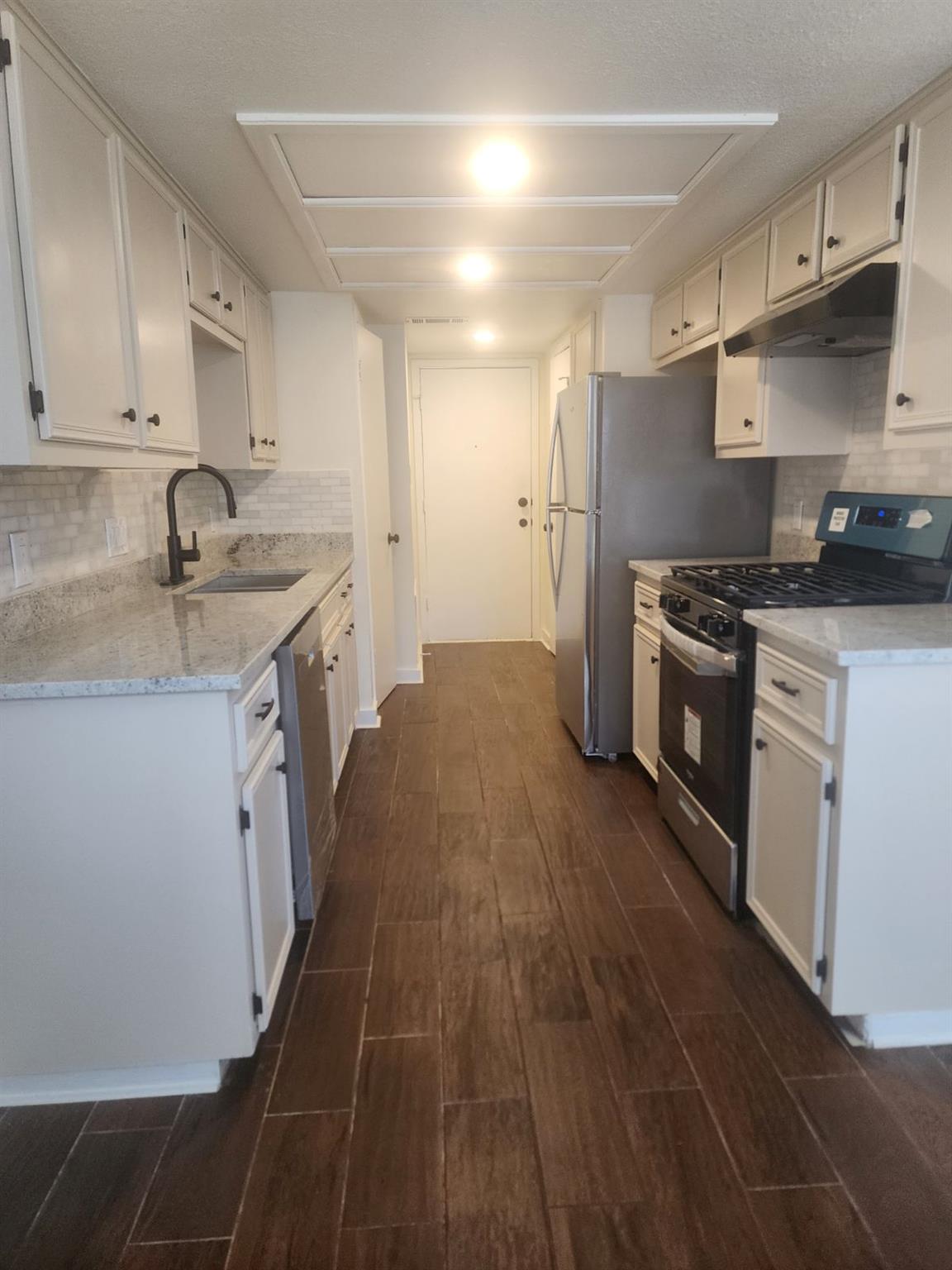 6905 Argonne Forest CV Unit #B - property photo 1 - Luxury home in Oak Forest West, Austin, TX