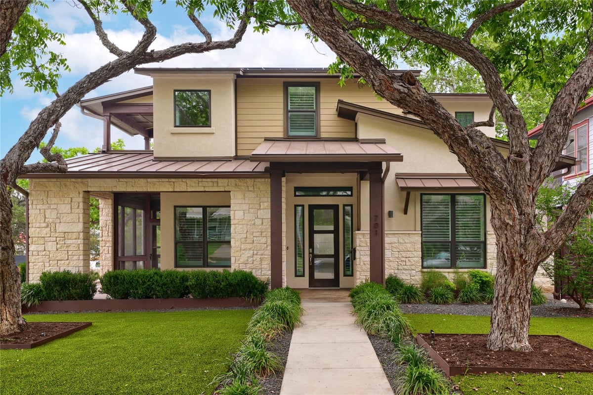 View 701 Josephine ST in Bluff View 701 Josephine ST - front exterior with traditional facade and large shade tree - Luxury home in Bluff View, Austin, TX