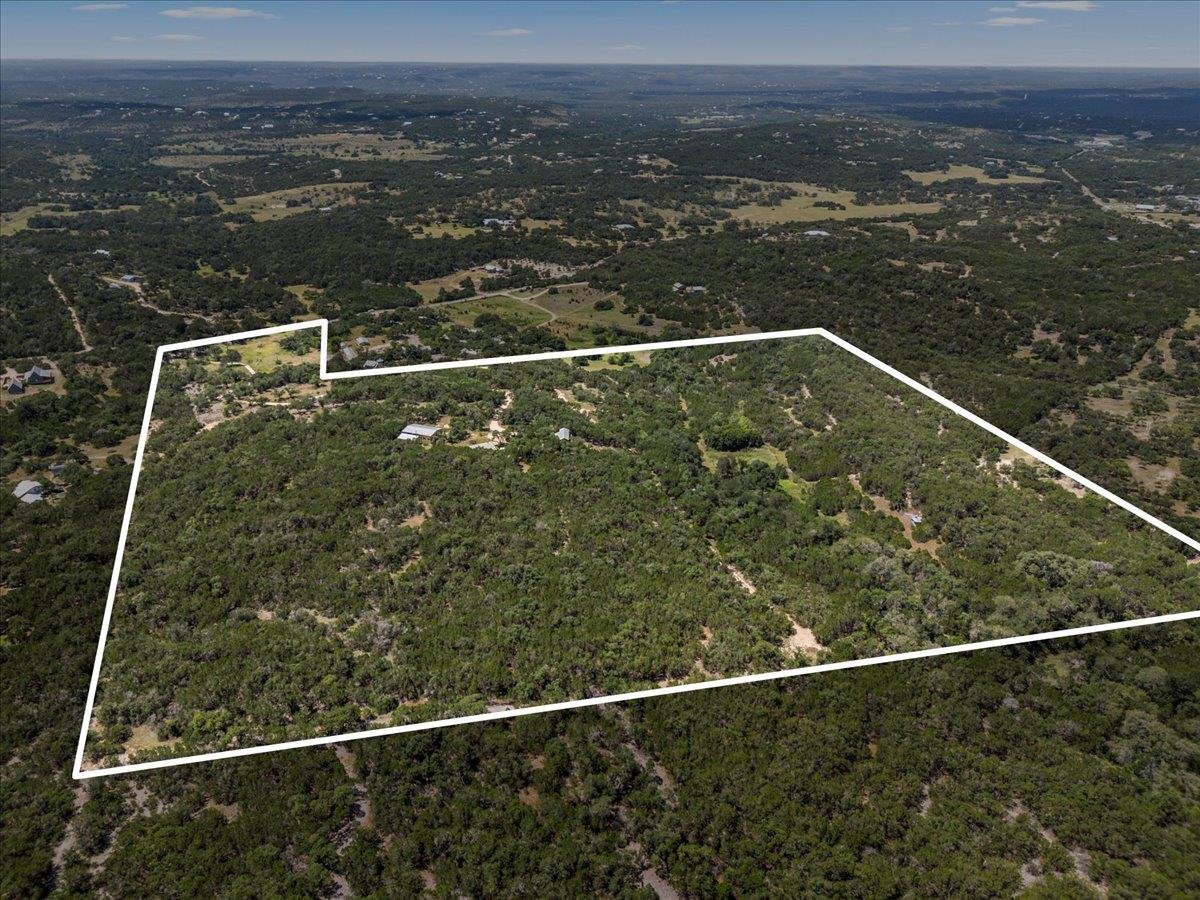 View 701 Old Oaks Ranch RD in Hollowrock Sub 701 Old Oaks Ranch RD - property photo 1 - Luxury home in Hollowrock Sub, Wimberley, TX