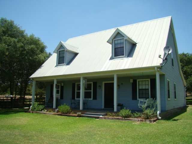 View 7013 Anders Daniels RD 7013 Anders Daniels RD - property photo 1 - Luxury home in La Grange, TX
