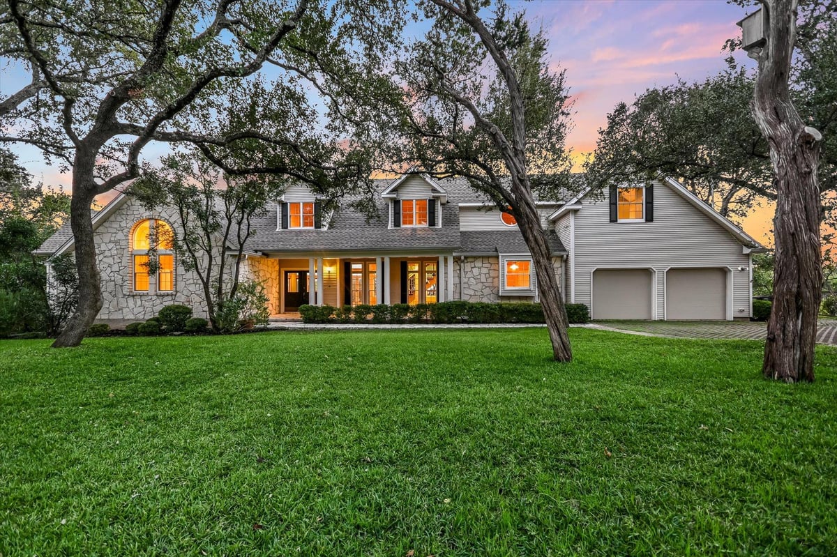View 705 Windsong Trl in Windsong Estates 705 Windsong Trl - front exterior with large West Lake Hills lawn - Luxury home in Windsong Estates, West Lake Hills, TX