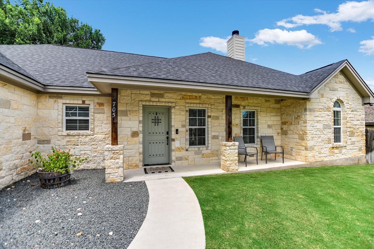 View 705 Woodland Park DR in Woodland Park 705 Woodland Park DR - front exterior - Luxury home in Woodland Park, Marble Falls, TX
