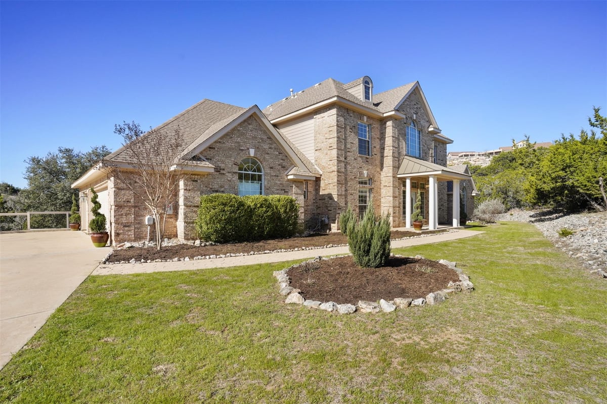 View 710 Timarron in Grand Mesa At Crystal Falls 710 Timarron - front exterior - Luxury home in Grand Mesa At Crystal Falls, Leander, TX