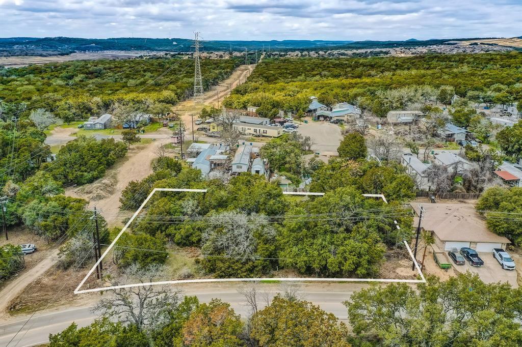 View 7100 Bar K Ranch Rd in Bar-K Ranches 03 7100 Bar K Ranch Rd - front exterior - Luxury lot in Bar-K Ranches 03, Lago Vista, TX