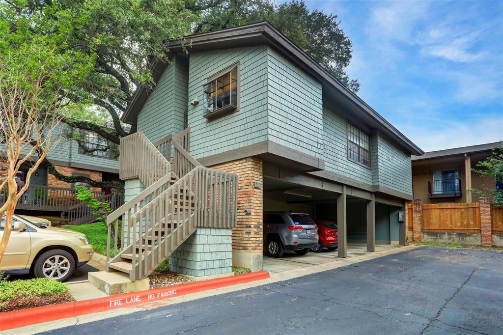 View 7122 Wood Hollow DR Unit #104 in Edgecliff NW Condo Amd 7122 Wood Hollow DR Unit #104 - front exterior - Luxury home in Edgecliff NW Condo Amd, Austin, TX
