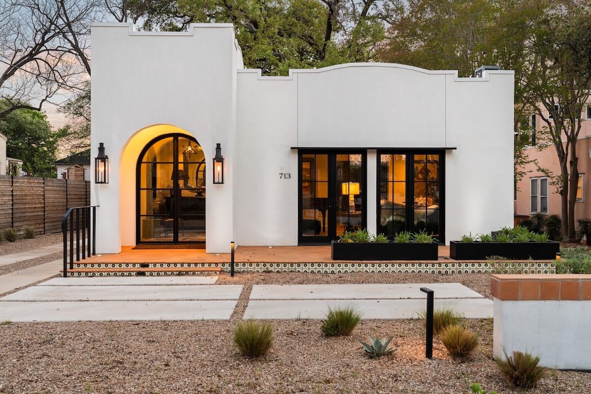 View 713 E 32nd St in Harris Park Add 713 E 32nd St - front exterior with white stucco modern facade - Luxury home in Harris Park Add, Austin, TX