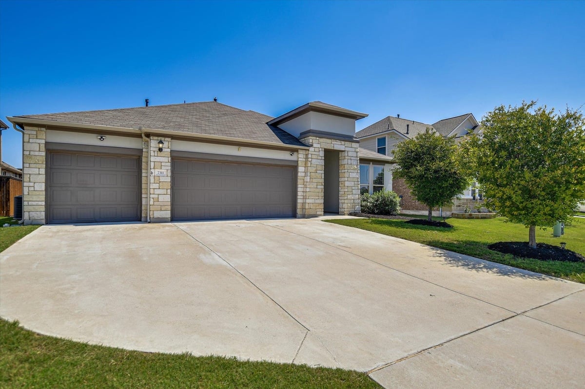 View 7311 Leonardo DR in Siena 7311 Leonardo DR - front exterior - Luxury home in Siena, Round Rock, TX