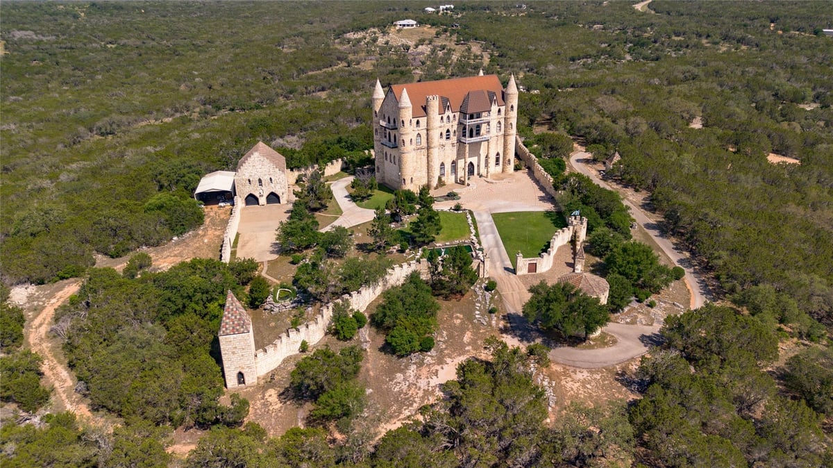 Aerial view with Castle architecture at 7400 Park Road 4 S - 7 bed 4 bath home