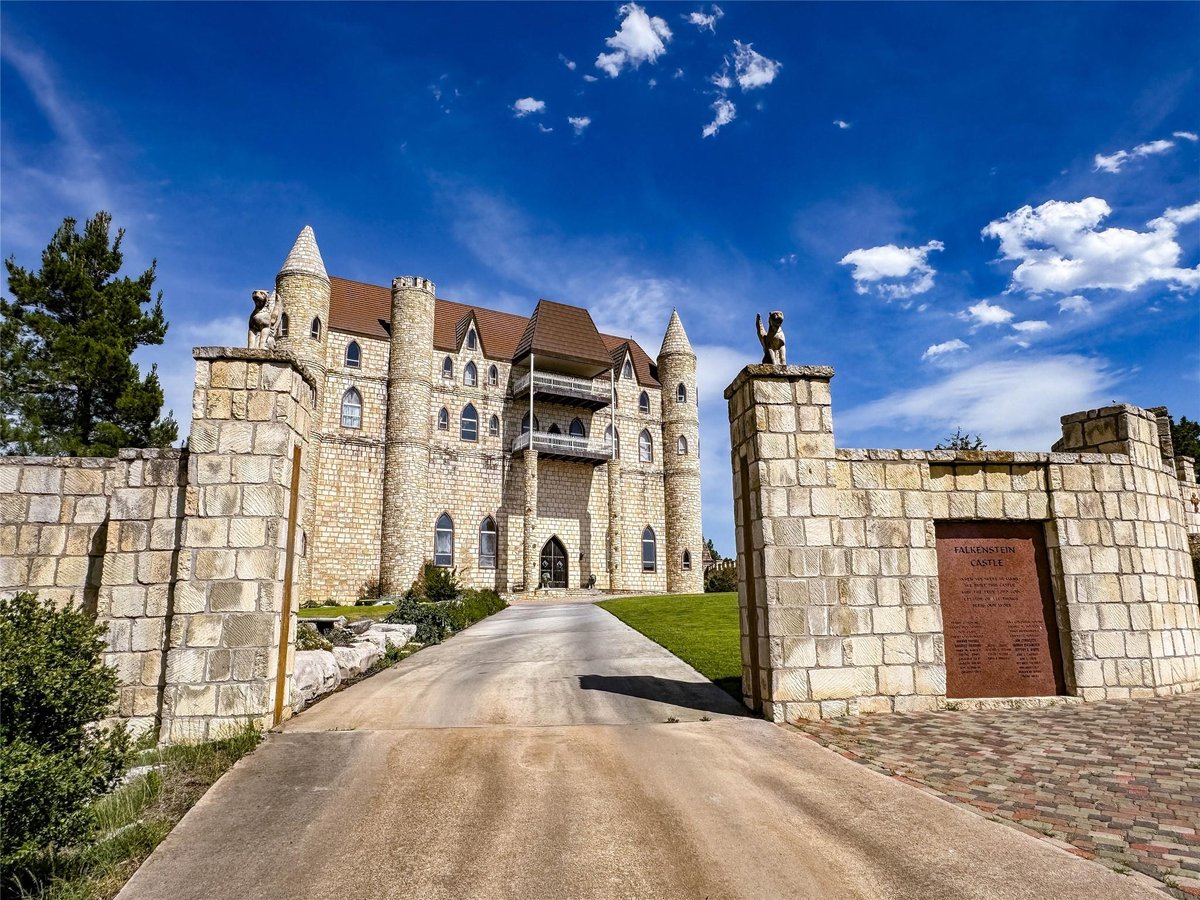 Front exterior with Castle architecture with turrets at 7400 Park Road 4 S - 7 bed 4 bath home