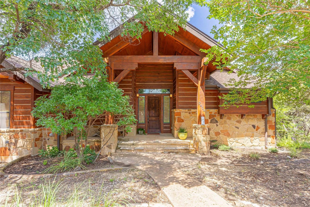 View 7404 Calming CT in BLUFFS THE AMENDED HOLLOWS 7404 Calming CT - front exterior - Luxury home in BLUFFS THE AMENDED HOLLOWS, Jonestown, TX