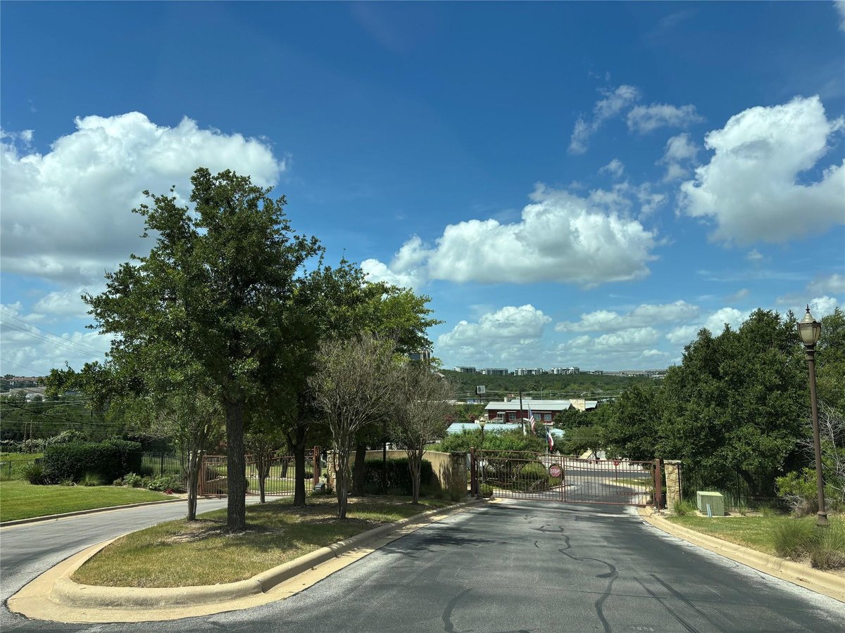 View 7424 Sunset Heights CIR Unit #F-26 in Aviara Condominiums 7424 Sunset Heights CIR Unit #F-26 - front exterior - Luxury home in Aviara Condominiums, Austin, TX
