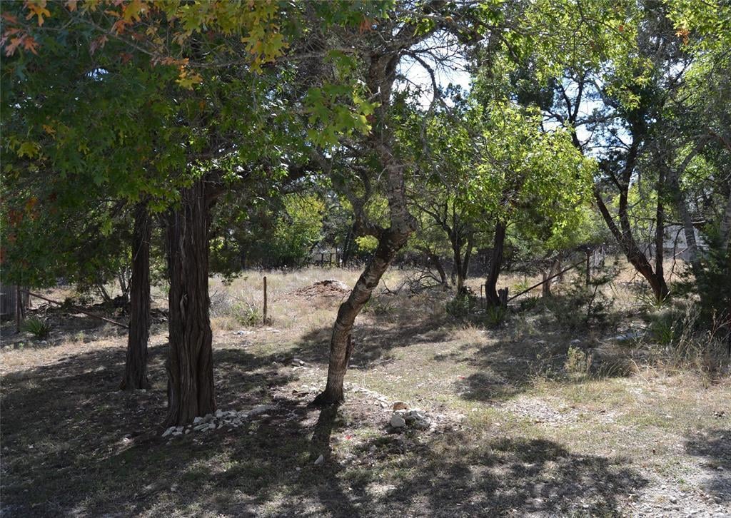 View 77 E Valley Spring Rd in Woodcreek 77 E Valley Spring Rd - front exterior - Luxury lot in Woodcreek, Wimberley, TX