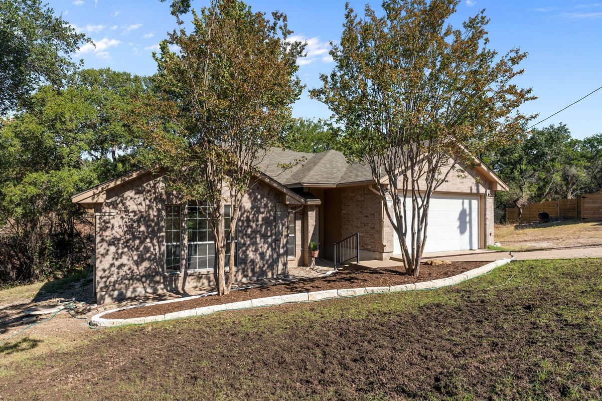 View 7704 Plateau Cv in Bar-K Ranches 06 7704 Plateau Cv - front exterior - Luxury home in Bar-K Ranches 06, Lago Vista, TX