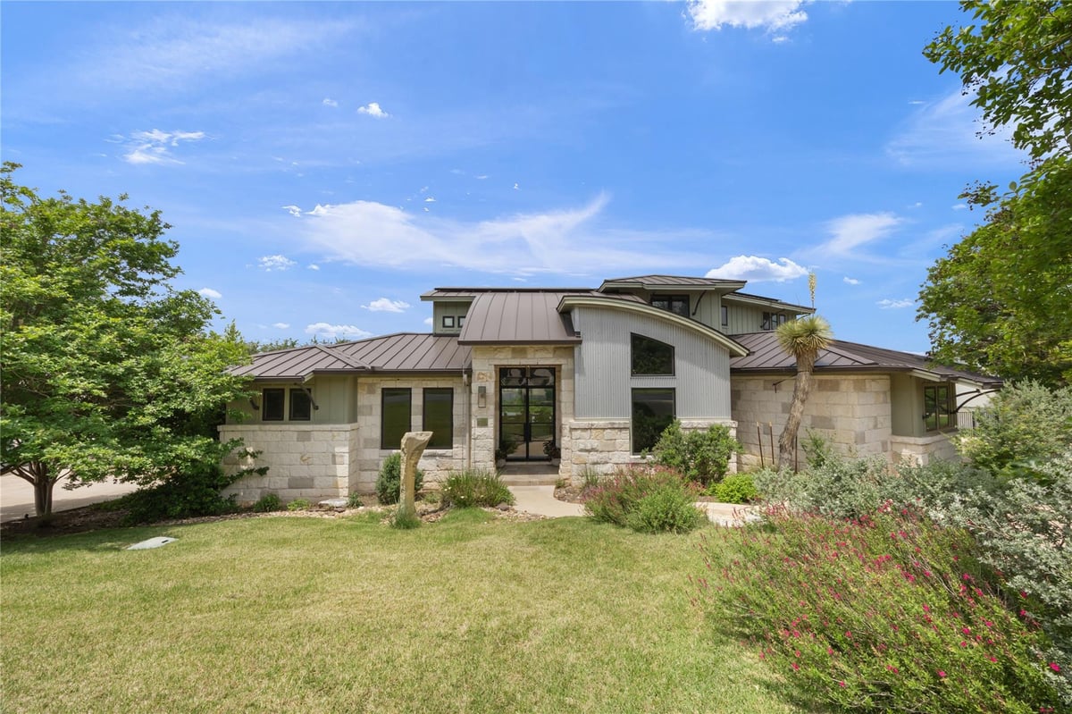 View 7714 Lenape Trl in Overlook Estates Ph 01 7714 Lenape Trl - front exterior - Luxury home in Overlook Estates Ph 01, Austin, TX