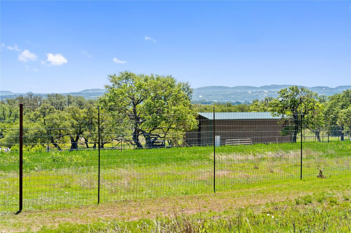 View 784 Ranch Road 2721 784 Ranch Road 2721 - front exterior - Luxury home in Johnson City, TX