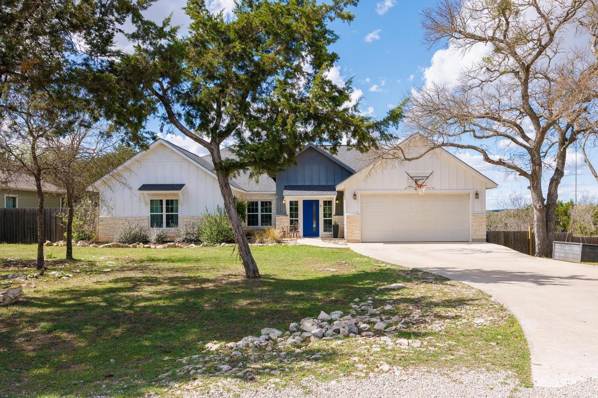 View 8 Butterfly St in Woodcreek Sec 15 8 Butterfly St - front exterior - Luxury home in Woodcreek Sec 15, Wimberley, TX