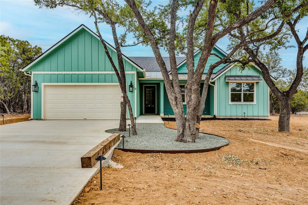 View 8 Huisache Ln in Woodcreek Sec 8 8 Huisache Ln - front exterior - Luxury home in Woodcreek Sec 8, Wimberley, TX