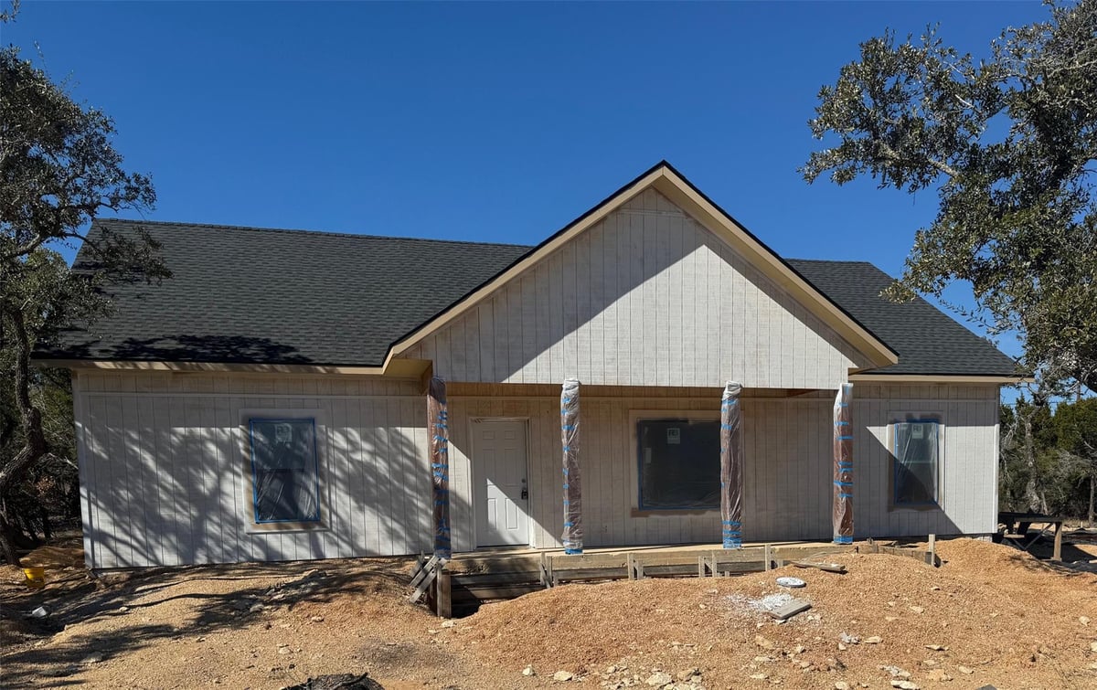 View 80 Cheyenne Trl in Woodcreek Sec 13 80 Cheyenne Trl - front exterior - Luxury home in Woodcreek Sec 13, Wimberley, TX
