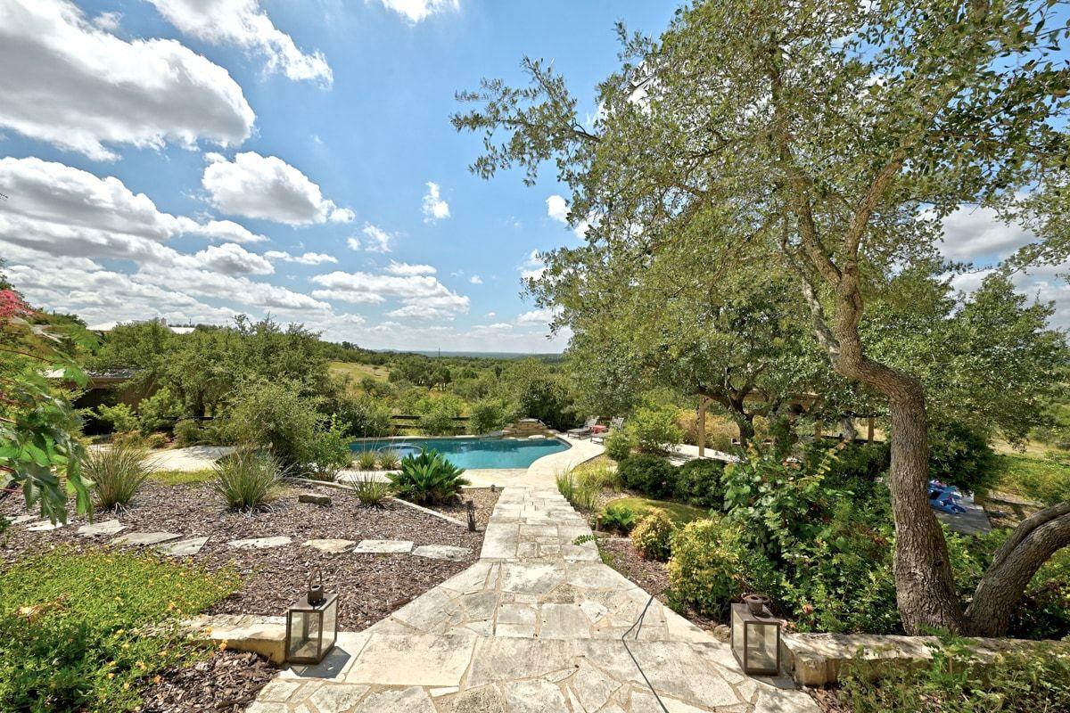 View 8075 Mount Sharp Rd in Mount Sharp Ranch 8075 Mount Sharp Rd - front exterior - Luxury home in Mount Sharp Ranch, Wimberley, TX