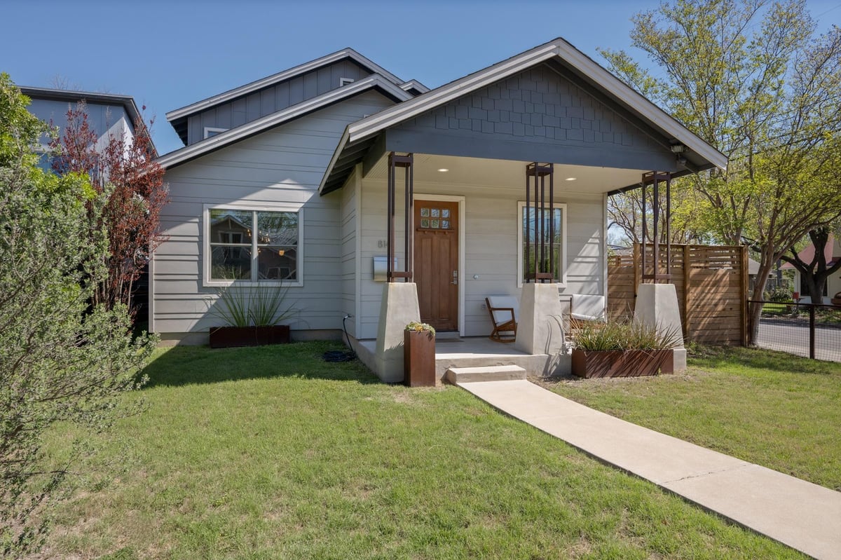 View 814 E 46th St in Red River 814 E 46th St - front exterior with single-story facade and front lawn - Luxury home in Red River, Austin, TX