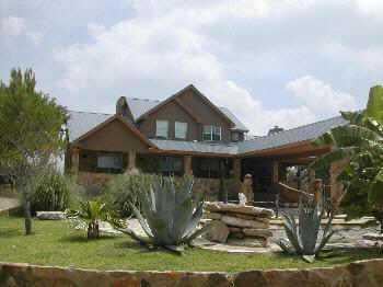 View 825 Heather Hills DR 825 Heather Hills DR - front exterior - Luxury home in Dripping Springs, TX