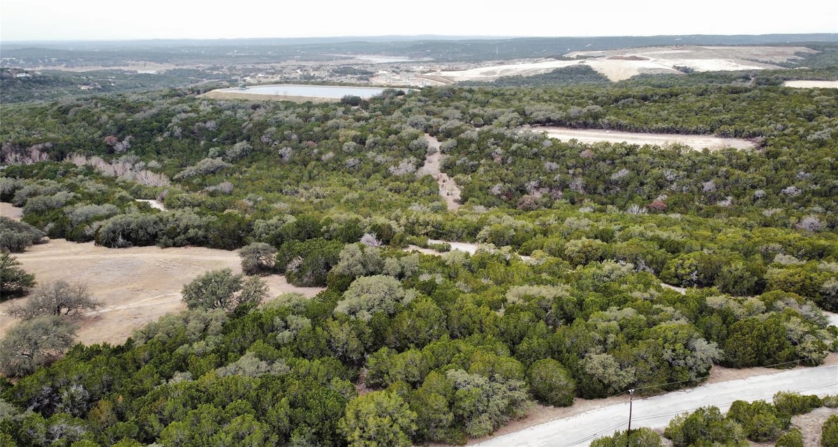 View 8446 Corral Ln in Bar-K Ranches 10 8446 Corral Ln - front exterior - Luxury lot in Bar-K Ranches 10, Lago Vista, TX