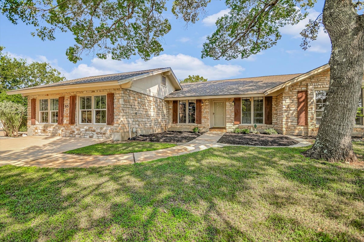 View 85 BROOKHOLLOW Dr in WOODCREEK 85 BROOKHOLLOW Dr - front exterior - Luxury home in WOODCREEK, Wimberley, TX