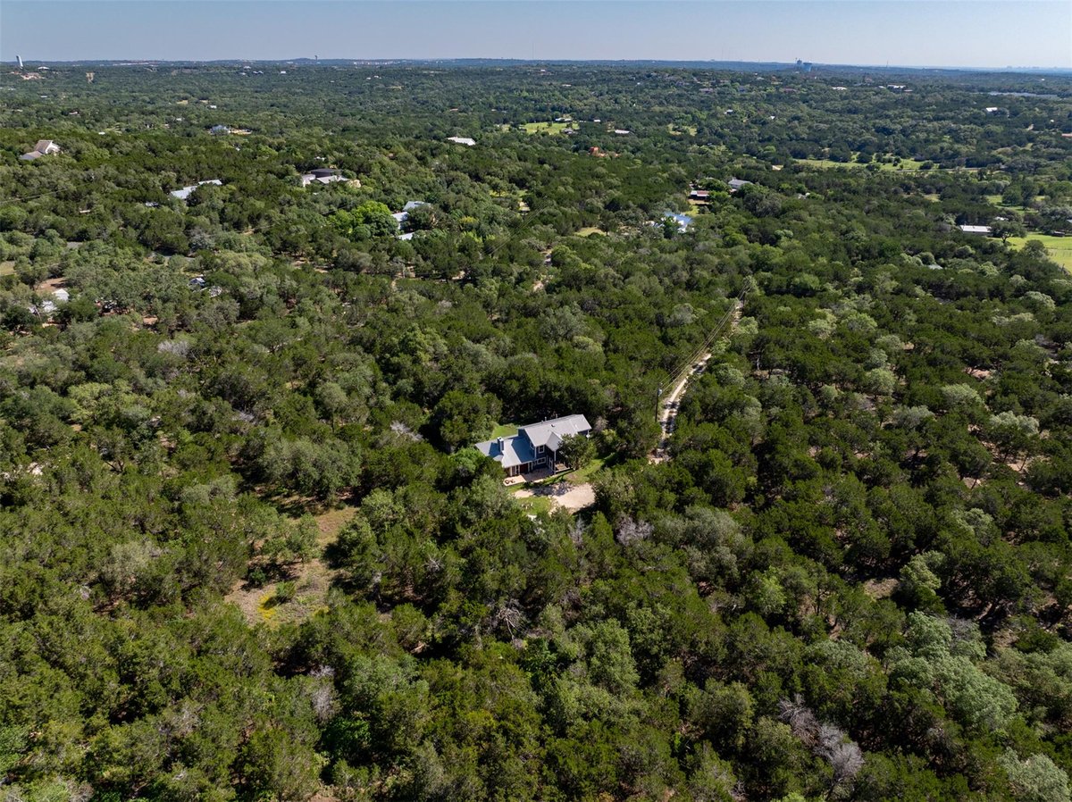 View 8705 Bear Creek DR in Bear Creek Oaks 8705 Bear Creek DR - front exterior - Luxury home in Bear Creek Oaks, Austin, TX