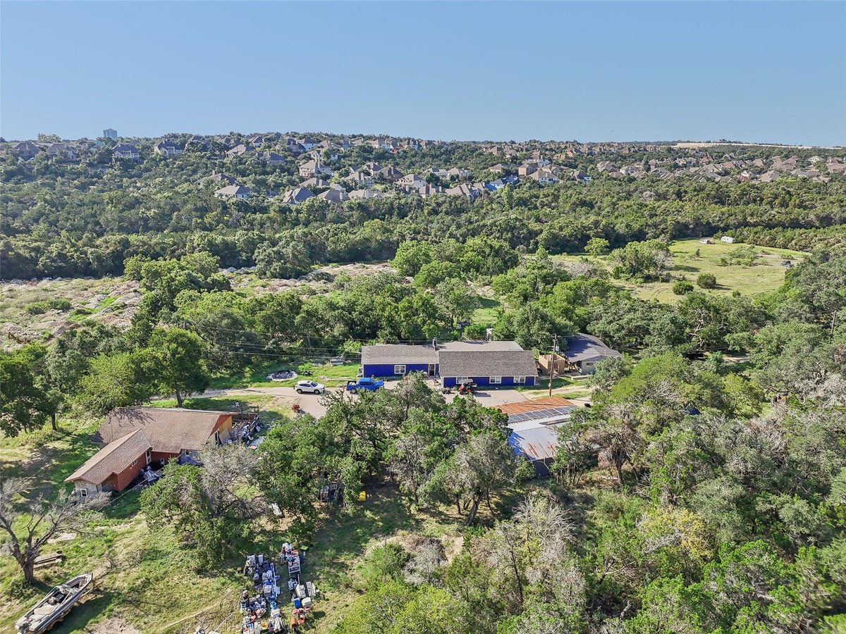 View 8737 W Highway 71 in Covered Bridge Whitecrowe Sub 8737 W Highway 71 - front exterior - Luxury home in Covered Bridge Whitecrowe Sub, Austin, TX
