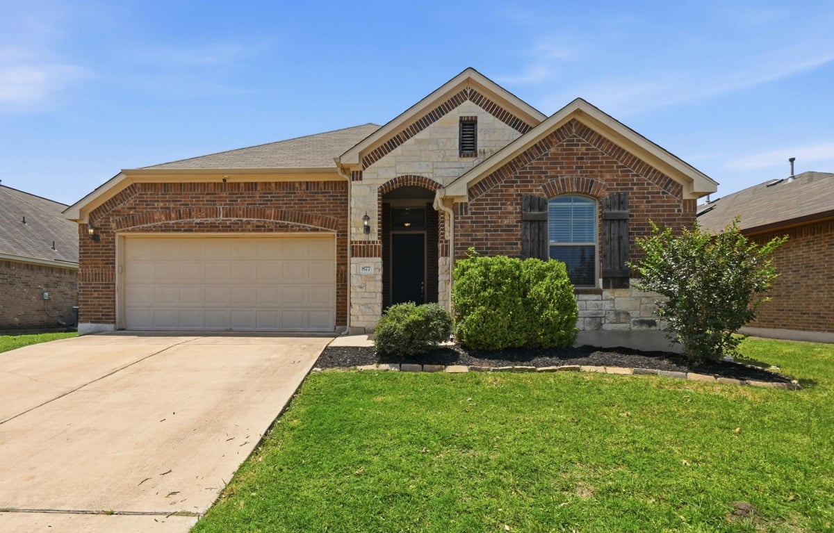View 877 Hot Spring VLY in The Meadows At Buda Sec Three-B 877 Hot Spring VLY - front exterior - Luxury home in The Meadows At Buda Sec Three-B, Buda, TX