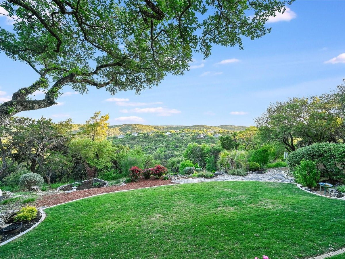 View 8813 Bell Mountain Dr in Long Canyon 8813 Bell Mountain Dr - front exterior - Luxury home in Long Canyon, Austin, TX