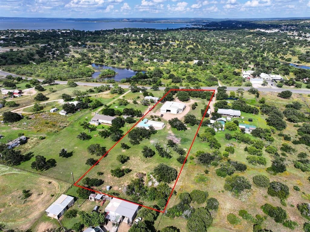 View 8963 W Ranch Road 1431 in Deer Hills 8963 W Ranch Road 1431 - property photo 1 - Luxury home in Deer Hills, Kingsland, TX