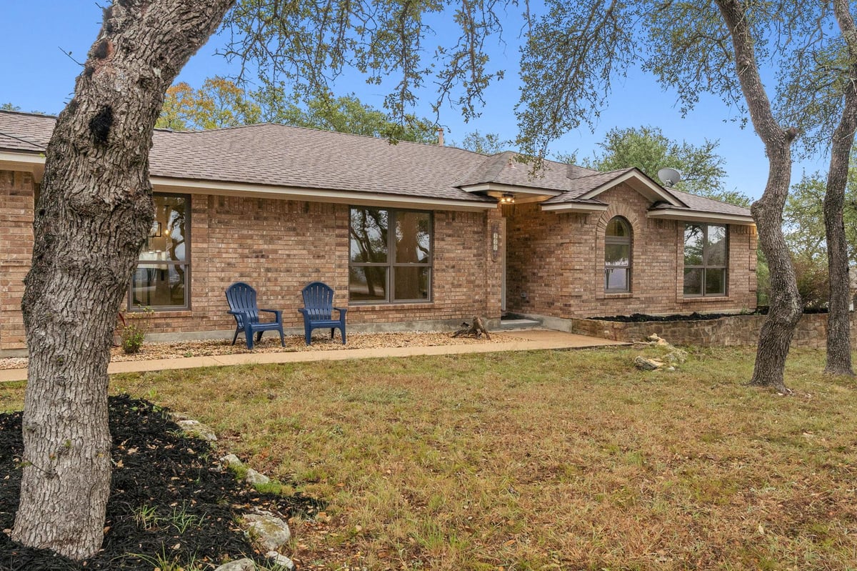 View 900 Morgan Hill DR in Meadow Oaks Ph I 900 Morgan Hill DR - front exterior - Luxury home in Meadow Oaks Ph I, Dripping Springs, TX