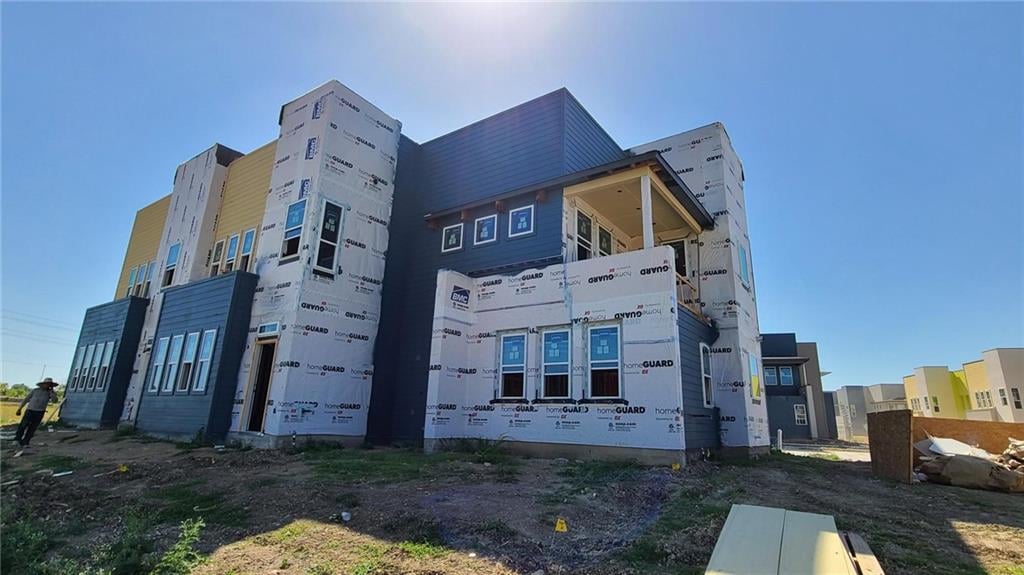 View 9015 Cattle Baron Path Unit #1401 in Goodnight Ranch Townhomes 9015 Cattle Baron Path Unit #1401 - front exterior - Luxury home in Goodnight Ranch Townhomes, Austin, TX