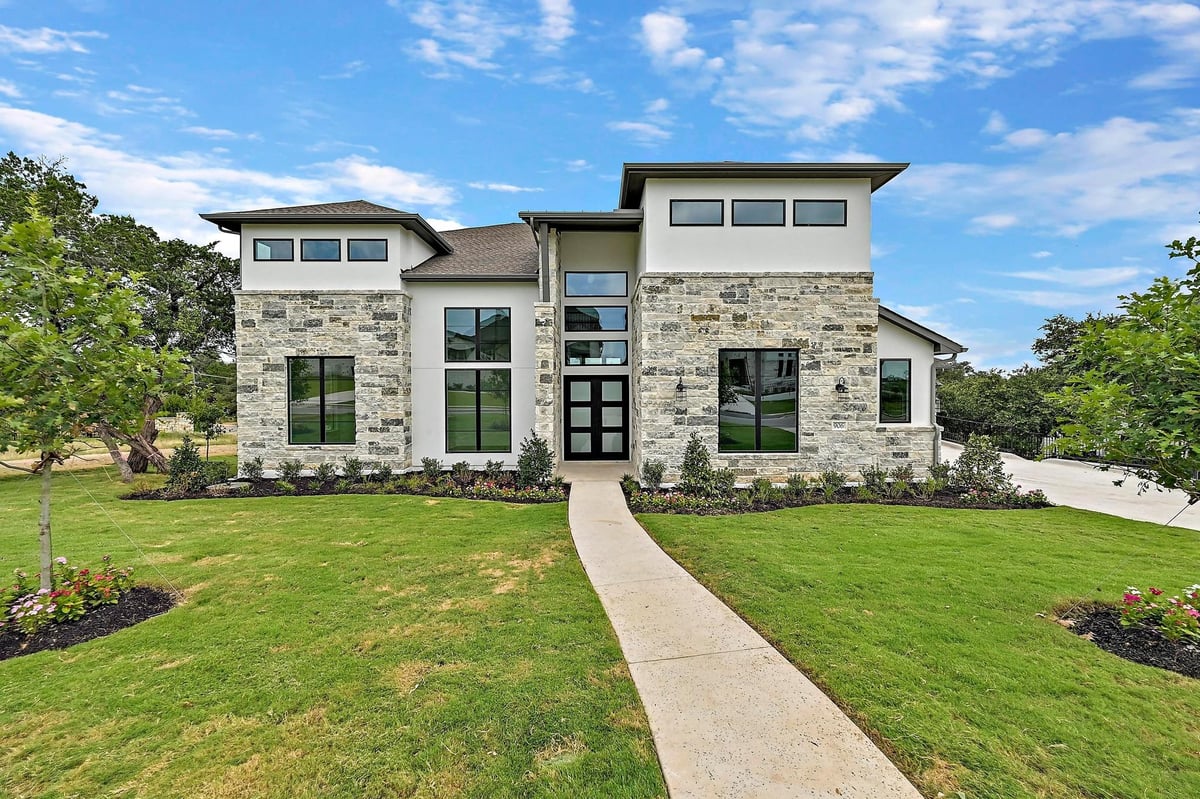 View 906 Bristol Creek Bnd in Rough Hollow 906 Bristol Creek Bnd - front exterior - Luxury home in Rough Hollow, Lakeway, TX