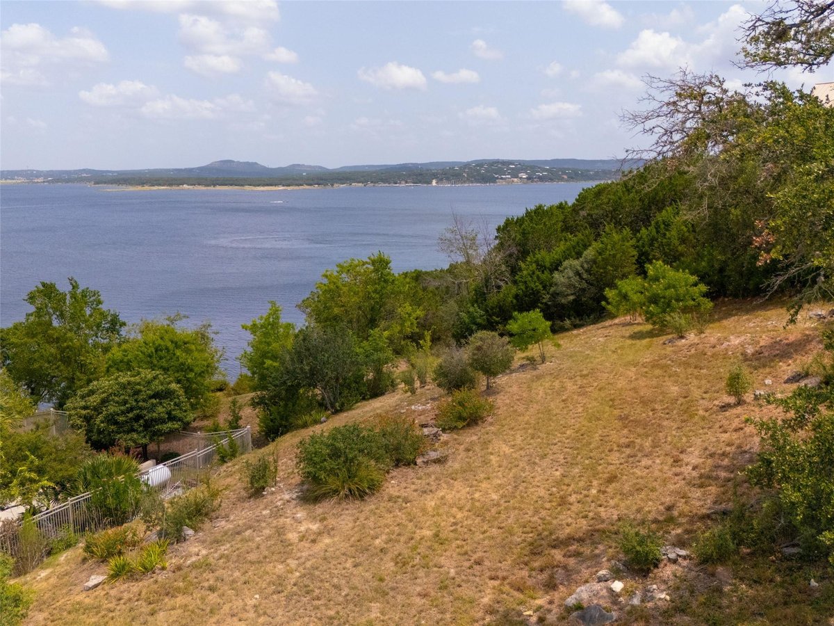 View 909 Janet DR in Canyon Lake Village West 6 909 Janet DR - property photo 1 - Luxury lot in Canyon Lake Village West 6, Canyon Lake, TX