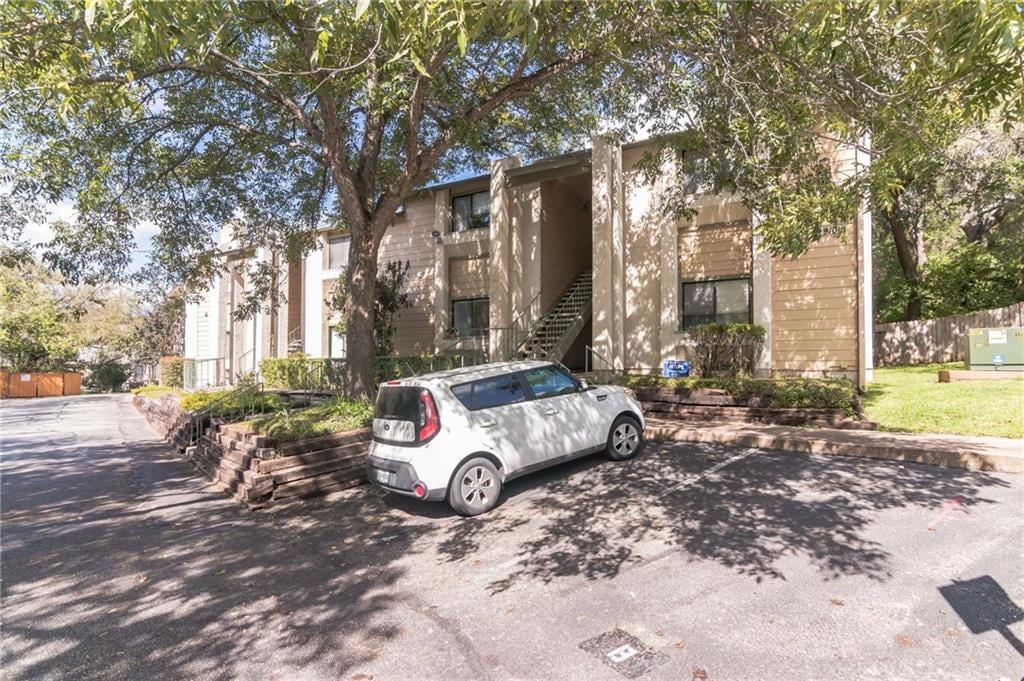 View 9100 Mountain Ridge Dr Unit #102 in Summerhouse Condo 9100 Mountain Ridge Dr Unit #102 - front exterior - Luxury home in Summerhouse Condo, Austin, TX