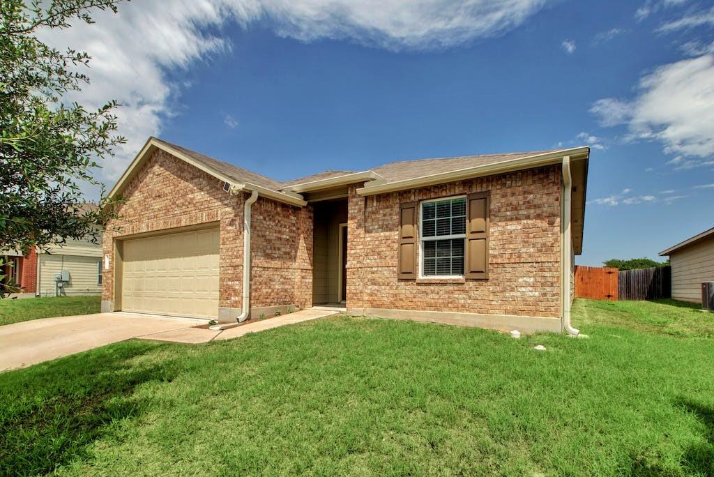 View 9112 China Rose Dr in Woodlands Sec 06 9112 China Rose Dr - front exterior - Luxury home in Woodlands Sec 06, Austin, TX